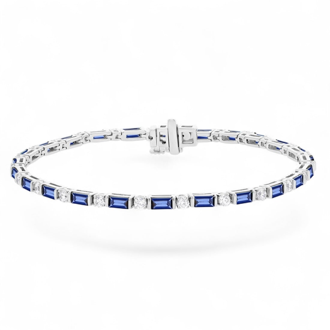 4x2 MM Blue Sapphires and 1.08 Ctw Art Deco White Diamond 14K White Gold Bracelets - Certified: Defining modern elegance, this magnificent Art Deco bracelet featuring Natural Diamonds and Sapphires captures the essence of style. Securely held in a classic Link design, the bracelet is forged from