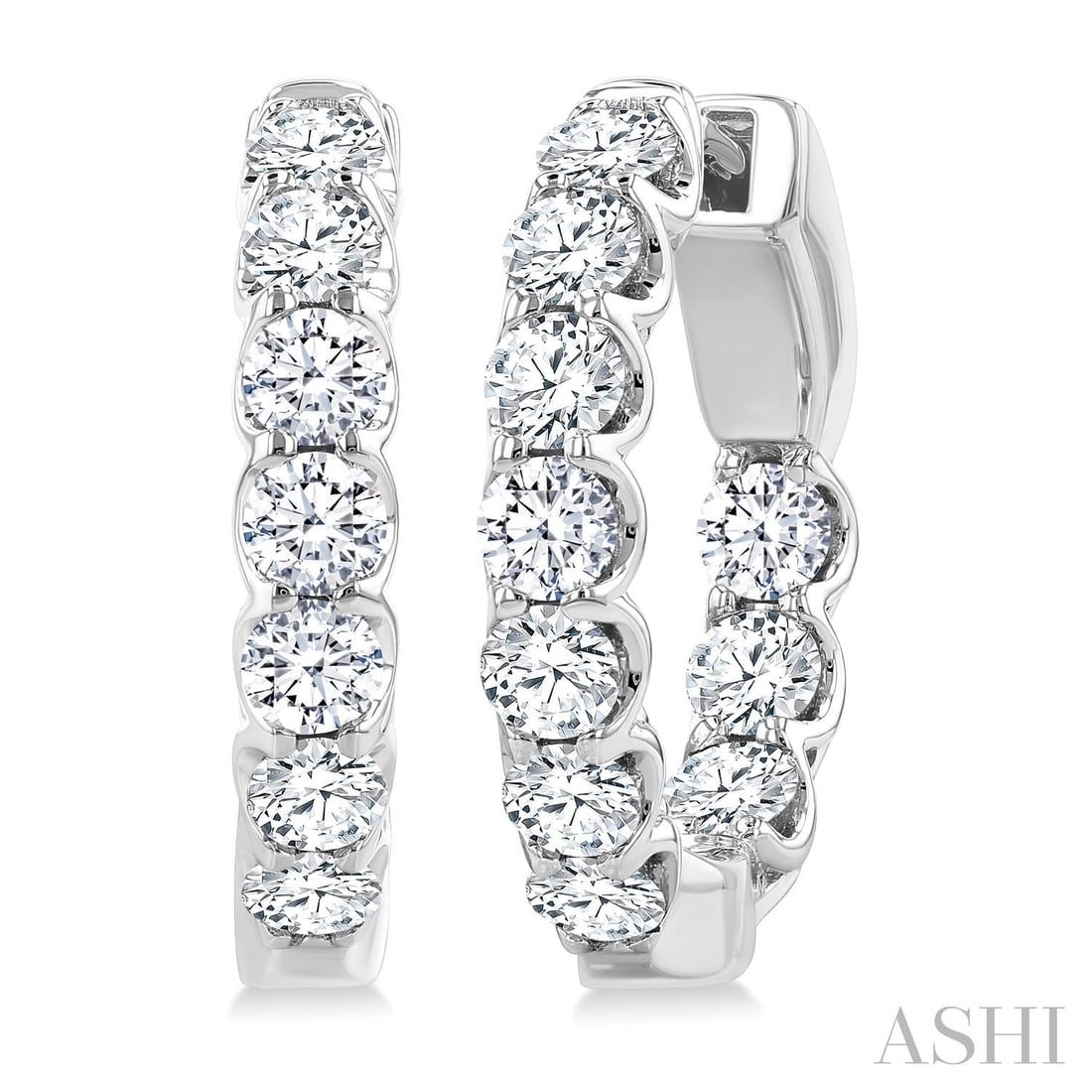 2.0 ctw White Diamond Inside-Out Hoop Earrings 14K White Gold: Captured in a moment of brilliance, this exquisite Inside-Out Embellished pair of earrings featuring White Diamond speaks to the connoisseur. Expertly mounted in a Hoop setting, the earrings are craft