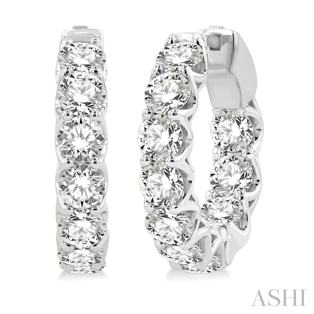 5.0 ctw Inside-Out White Diamond 14K White Gold Hoop Earrings: A vision of luxury, this stunning Inside-Out pair of earrings featuring White Diamonds defines sophistication. Securely held in a classic Hoop design, the earrings are forged from 9.85 grams of high-p