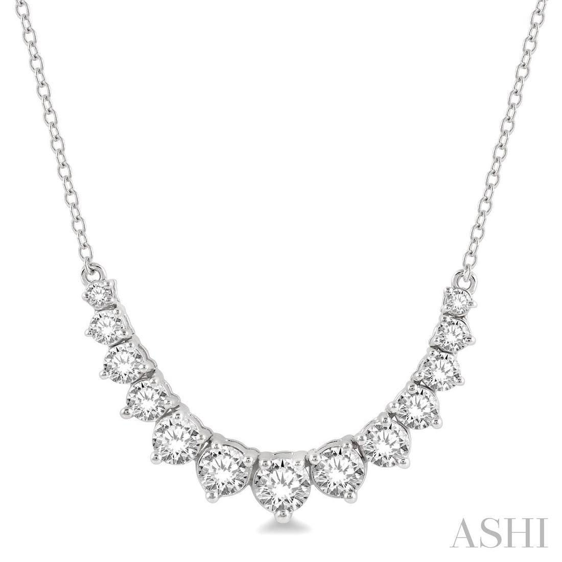 1.0 ctw Graduated Diamond Smile 14K White Gold Necklace: An exquisite masterpiece of haute joaillerie, this magnificent Smile necklace featuring White Diamond is a true treasure. Showcasing the gems in a Graduated Line arrangement, the necklace consists of 