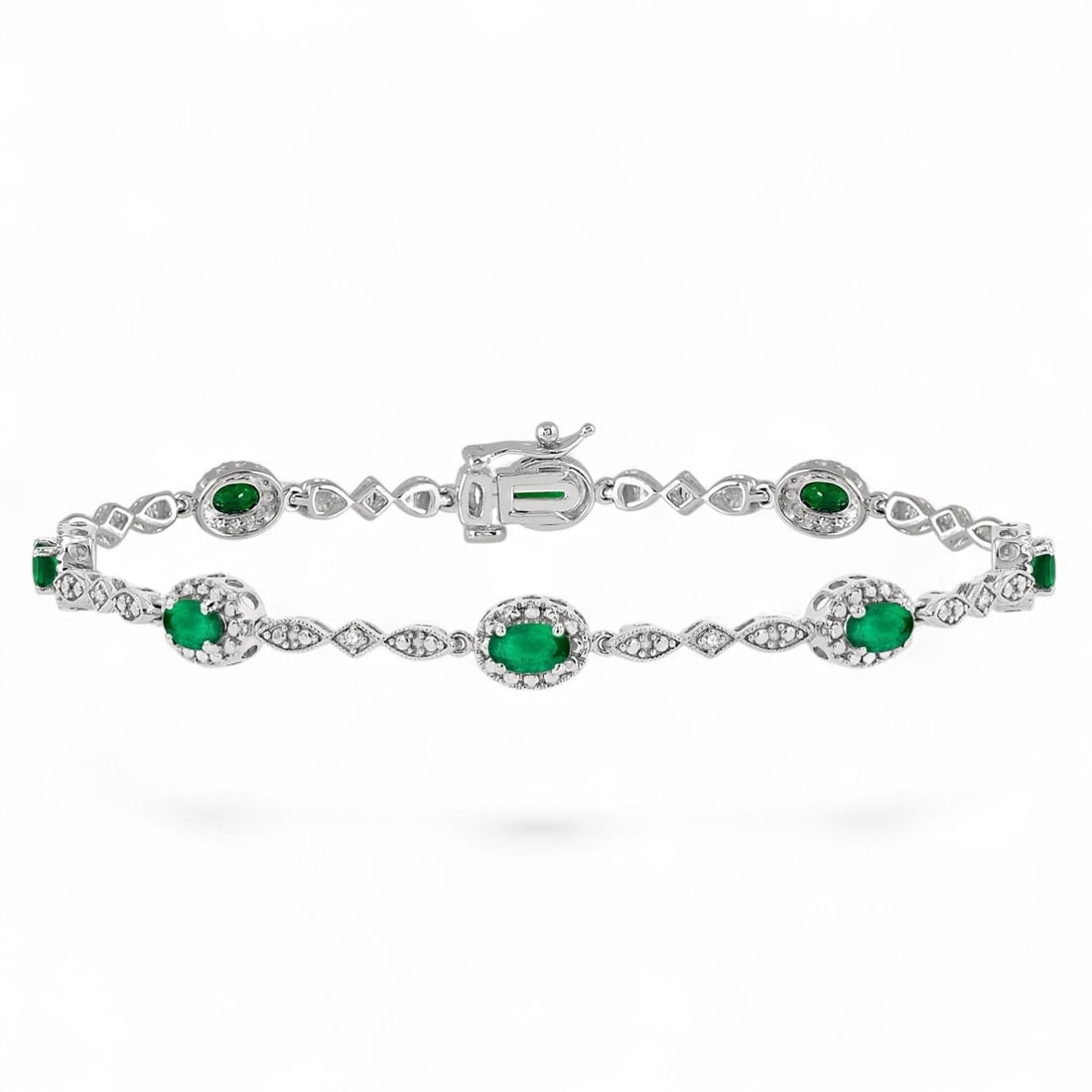 5x3 MM Emeralds and 0.05 Ctw Halo White Diamond Modern 10K White Gold Bracelet - Certified: A vision of luxury, this stunning Halo bracelet featuring Natural Diamonds and Emeralds defines sophistication. Securely held in a classic Halo design, the bracelet is forged from 5.1 grams of high-po