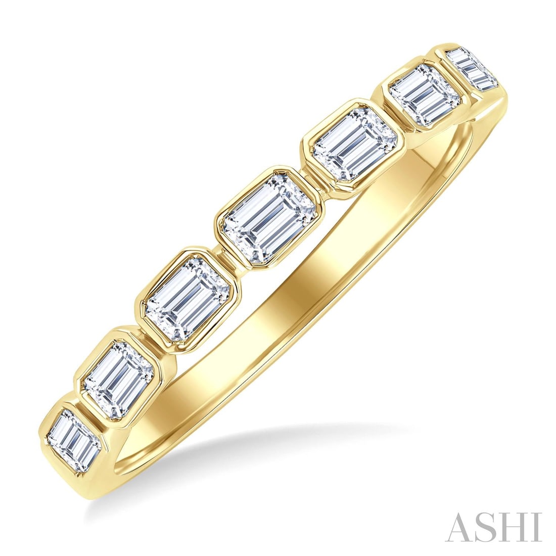 0.70 ctw Emerald Cut East-West Bezel Diamond 14K Yellow Gold Band Ring: Captured in a moment of brilliance, this magnificent East-West Emerald Cut Bezel ring featuring White Diamond speaks to the connoisseur. The gemstones are nestled within a Bezel framework, supported b