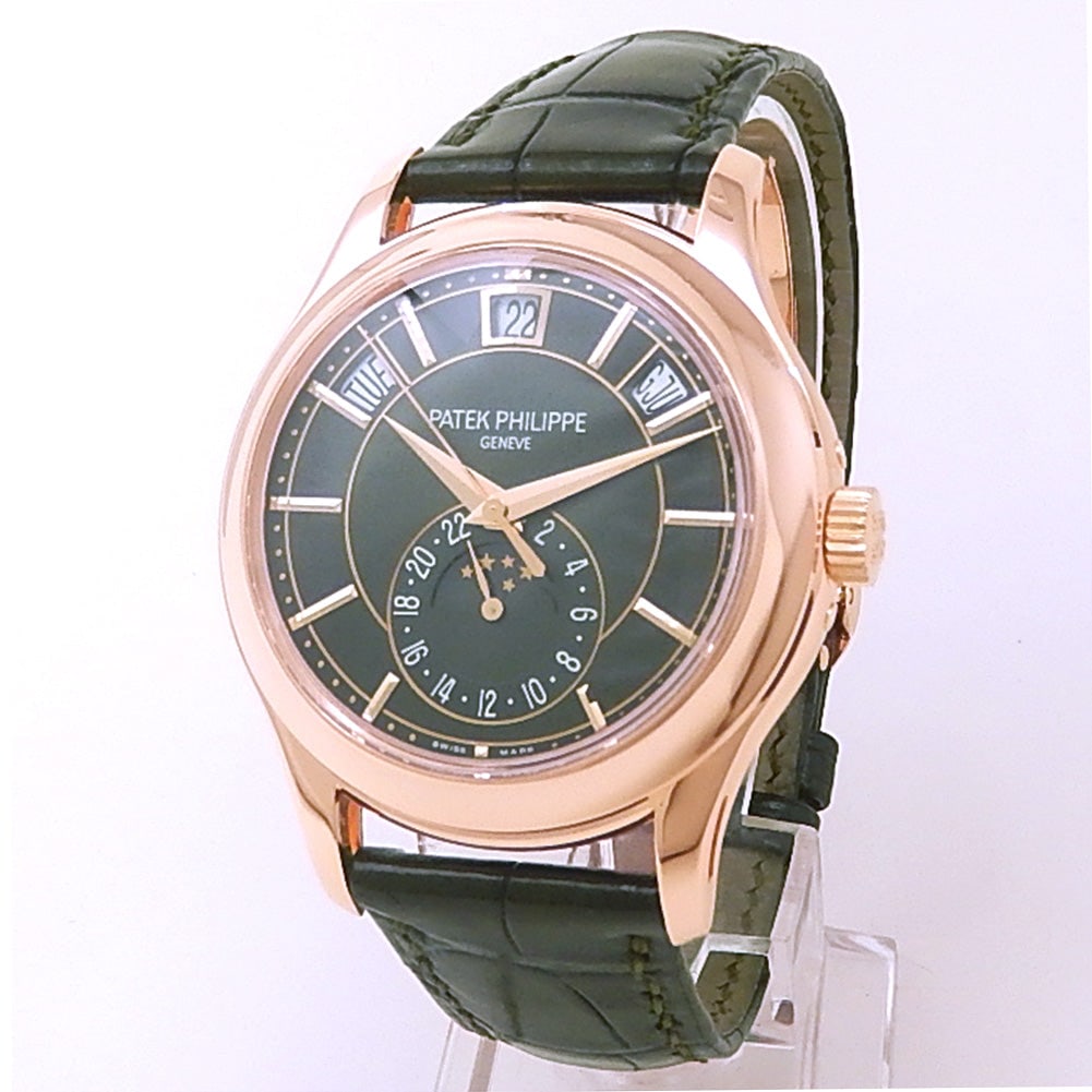Patek Philippe Complications Annual Calendar 5205R-011 18k Rose Gold Green Dial: The Patek Philippe Complications Annual Calendar, Reference 5205R-011, represents the pinnacle of haute horlogerie and sophisticated design. Encased in lustrous 18k Rose Gold, this remarkable timepiec
