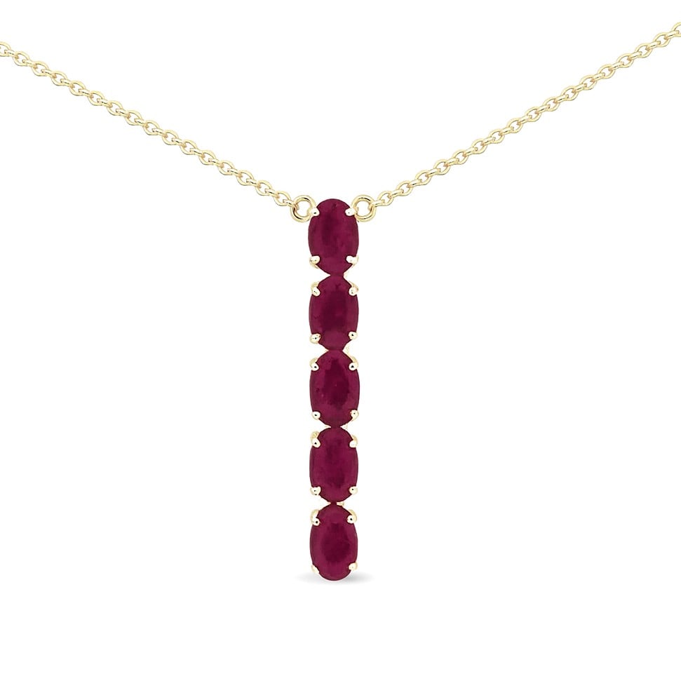 2.07ct Oval Ruby Straight Line Vertical 14K Yellow Gold Pendant: An exquisite masterpiece of haute joaillerie, this elegant Straight Line Vertical pendant featuring Ruby is a true treasure. A detailed Straight Line gallery secures the stones, rendered in 3.0 grams 