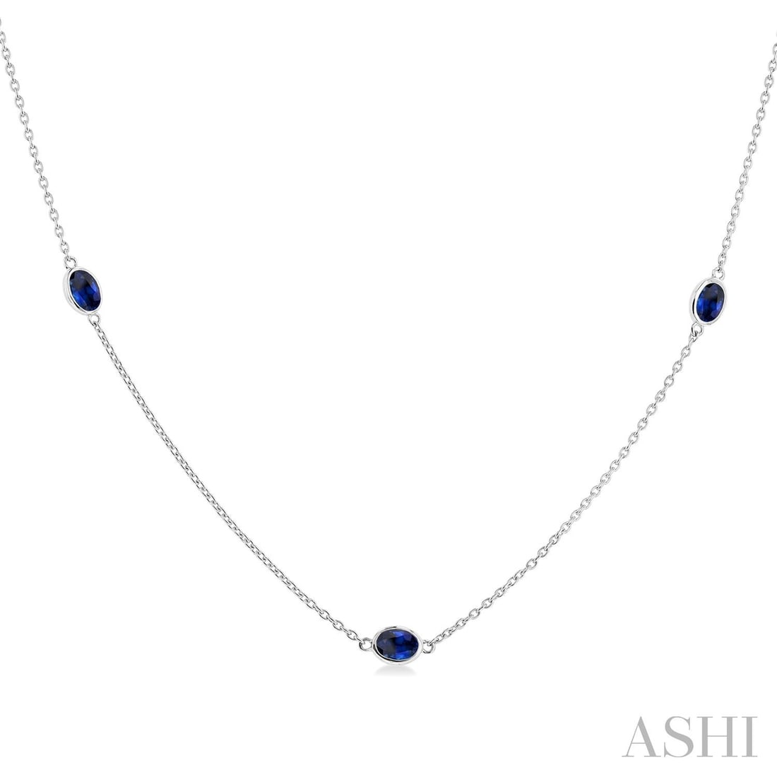 4x3 mm Oval Sapphire 14K White Gold Station Necklace: Rare and radiant, this elegant Station necklace featuring Blue Sapphire offers a touch of the extraordinary. Crafted with precision, the Bezel setting is seamlessly integrated into 2.45 grams of 14K W