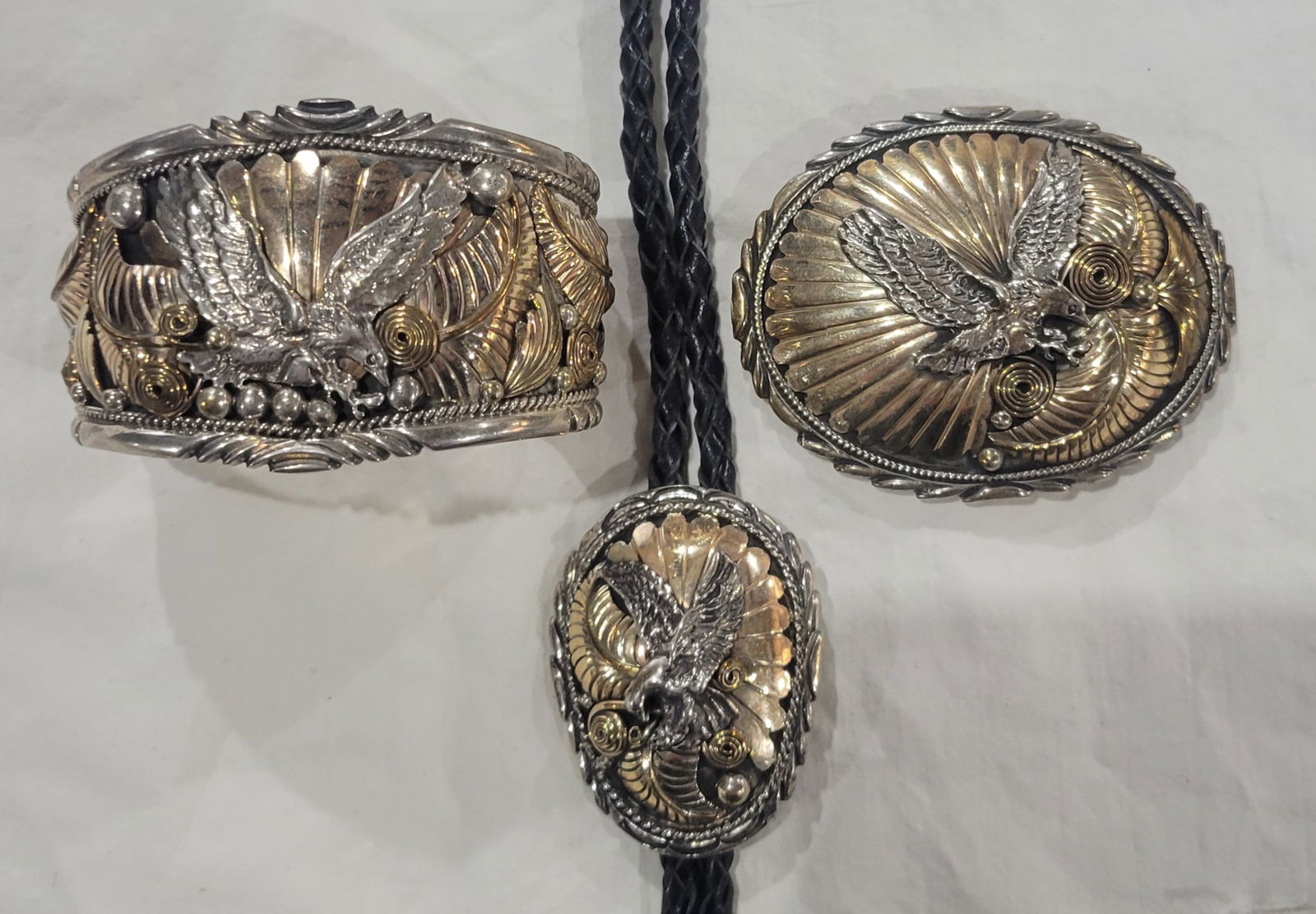 Montana Silversmiths Eagle Bolo Tie, Cuff and Belt Buckle: Sterling Silver and Goldtone Flying Eagle SET - Bolo tie, Cuff and Belt Buckle - Sterling Silver