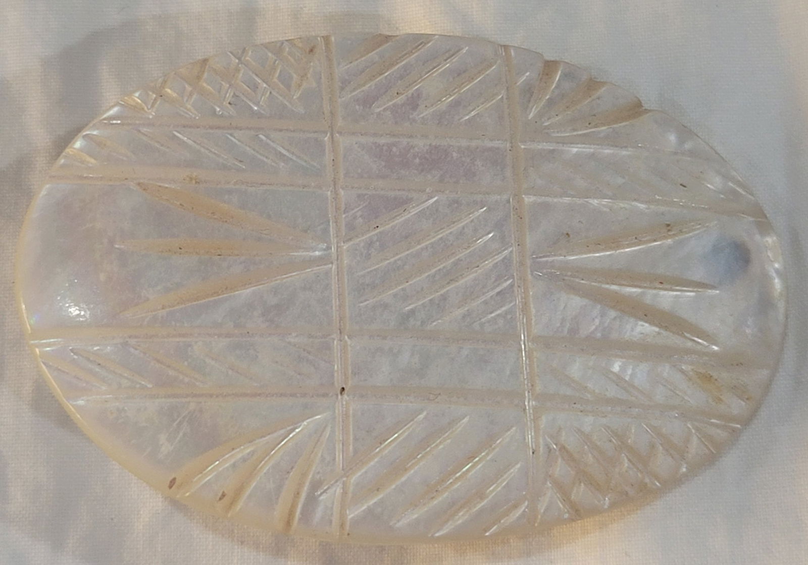 Vintage Hand Carved Motehr of Pearl Brooch Pin: Hand Carved mother of pearl brooch pin with a geometric pattern