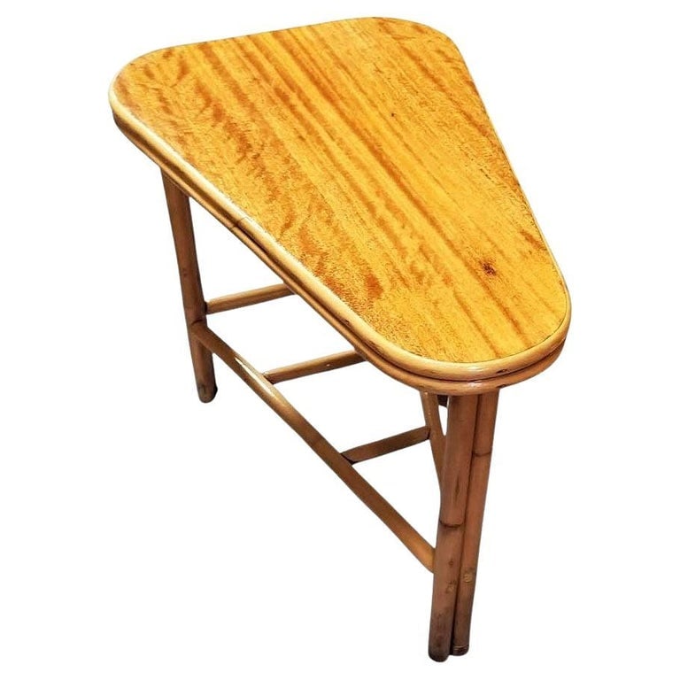 Restored MCM Rattan & Mahogany "Surfbaord" Wedge Side Table w/ Bottom Rack: This beautifully restored rattan wedge table blends style and vintage charm with modern comfort. Made in 1950, it features a mahogany top standing on a single-strand rattan frame with a two-strand fro