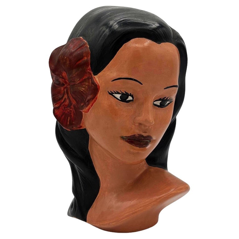 1968 California Art Pottery Hawaiian Polynesian Hula Girl Bust Statue, Signed: Mid-century Hawaiian Polynesian boy Ceramic bust statue by Marwal. The statue features a hand-sculpted bust of a young Polynesian girl with red hibiscus and black hair that has been hand-painted by th