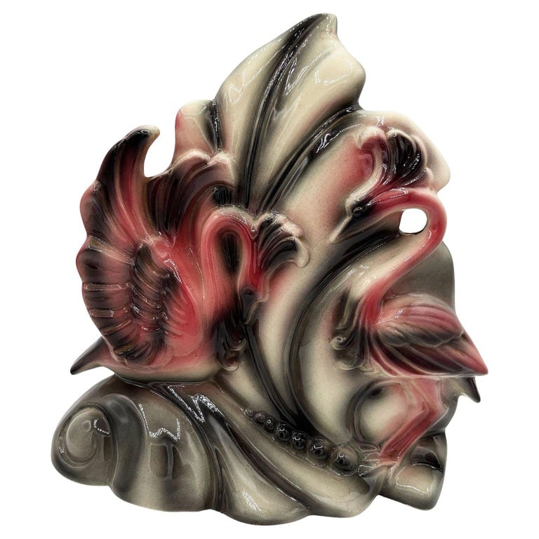 Mid-century California Pottery Ceramic Pink Swan Leaf TV Table Lamp: Mid-century pink and white ceramic California pottery Sawn TV accent lamp. The table lamp features a beautifully detailed pink flamingo with open wings against a tropical palm leaf. It comes in a glos