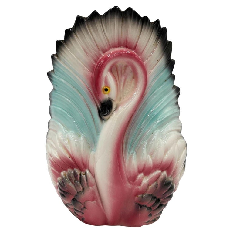 Mid-century California Ceramic Pottery Pink Flamingo w/ Open Wings TV Table Lamp: Mid-century pink and green ceramic California pottery flamingo TV accent lamp. The table lamp features a beautifully detailed pink flamingo with open wings form the shade for the lamp. It comes in a g