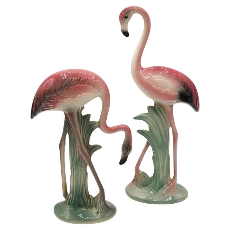 Mid-century Matching Pink Flamingo Ceramic Tabletop Vase Set By Brad Keeler: Mid-century pink and green matching California ceramic flamingo tabletop statues by Brad Keeler. The set features two beautifully detailed pink flamingos in lush green leaves and grass with a pink col