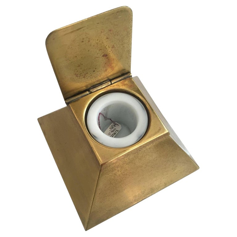 1920s Art Deco Egyptian Revival Brass Pyramid Inkwell With Milk Glass Holder: Original 1920s Art Deco era Egyptian Revival pyramid-shaped brass inkwell with milk glass ink container. The ink well has a top-hinged lid for easy access to ink when needed and is a great example of
