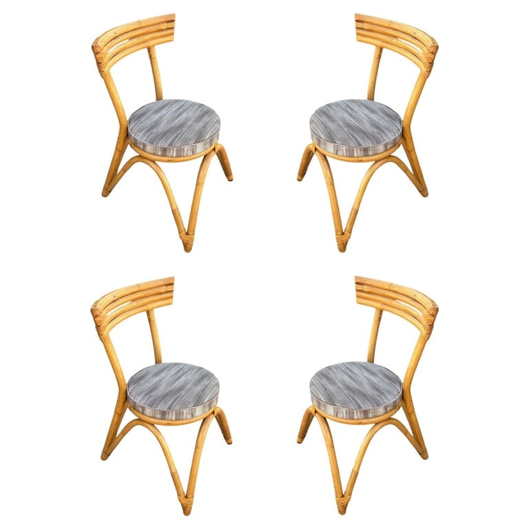Restored Arched "Zig -Zag" Leg Rattan Dining Chair, Set of Four: This beautifully restored Paul Frankl-inspired set of four rattan arched "Zig-Zag" leg dining chairs combines natural beauty with mid-century modern design. With updated finishes, these chairs provide