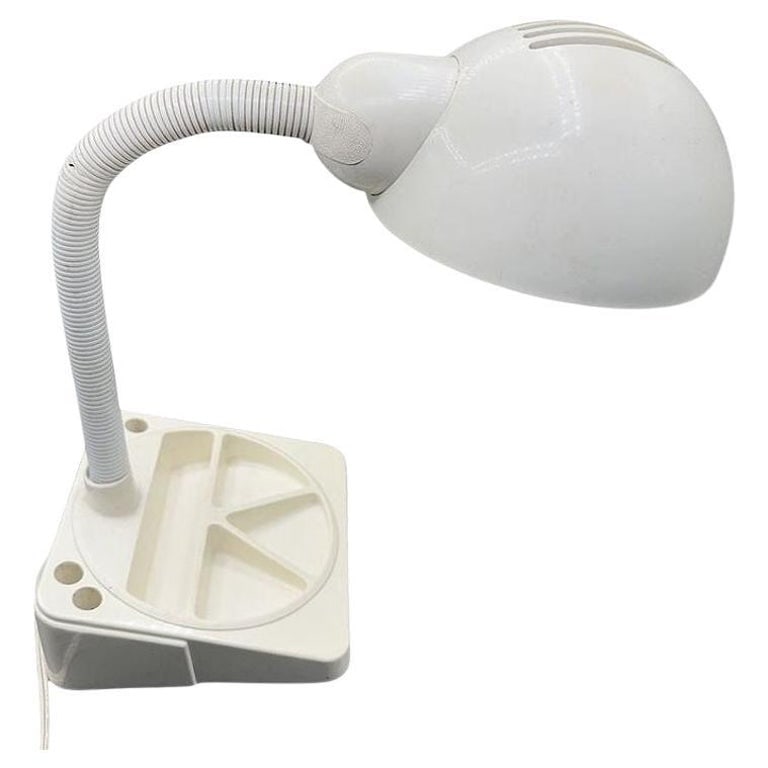 1970 Mod Space Age White Plastic Gooseneck Desk Lamp by Mobilite: 1970 Space Age Mod style White Plastic Gooseneck Desk Lamp by Mobilite. This retro classic in white plastic and features a 6" square base with compartments for desk accessories. The flexible gooseneck