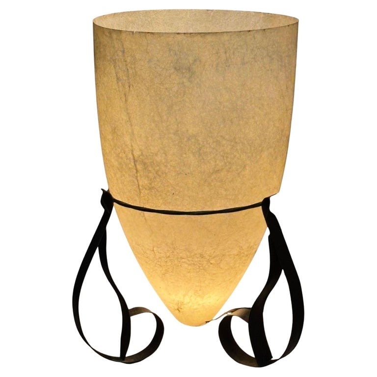 Large 2' 4" Mid Century Fiberglass Cone Shade Spanish Colonial Lamp: This mid-century modern lamp exudes a timeless charm, featuring a graceful fiberglass cone shade and a sturdy iron base. The shade's soft, creamy white hue complements the dark, antique bronze finish