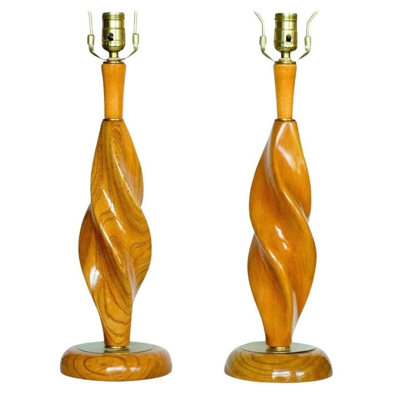 Mid-century Carved Spiral Oak & Brass Sculptural Table Lamps by Yasha Heifetz: A striking pair of Mid-Century Spiral Carved Oak and Brass Sculptural Table Lamps by Yasha Heifetz. Each lamp embodies the bold modern artistry and craftsmanship the artist is known for, carved in a f