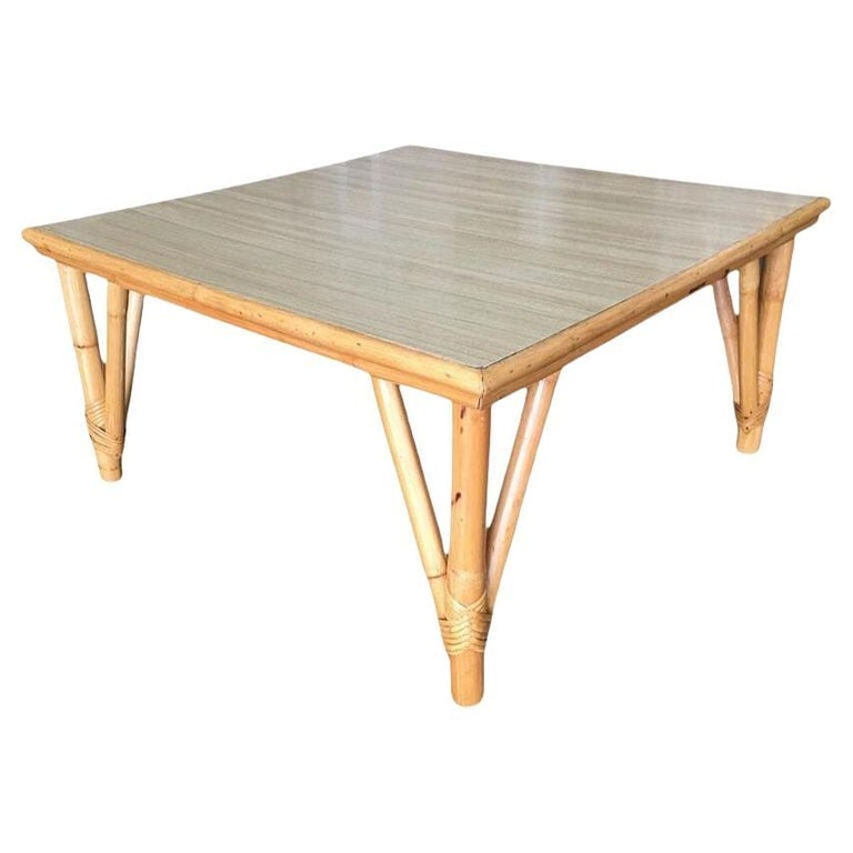 Restored Mid-century Large Square Rattan Coffee Table With Formica Top: This beautifully restored Paul Frankl-inspired Large 31" long square coffee table with pole rattan legs and a wood grain formica top with a rattan trim along the borders. it is meticulously refinished