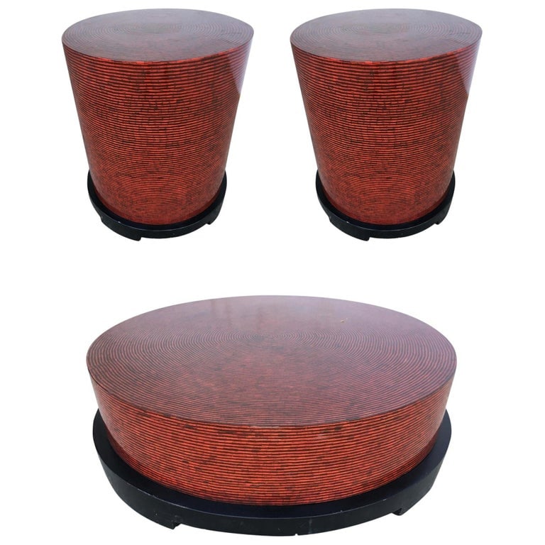 Two-Tone Cubist Style Round Livingroom Set, Circa 1990: Pair of v round side table and coffee table with red and tan textured vinyl tops.Circa 1990Measures: Coffee table Height: 12 in. X diameter: 44 in.Side tables: Height: 20 in. X diameter: 22 in.