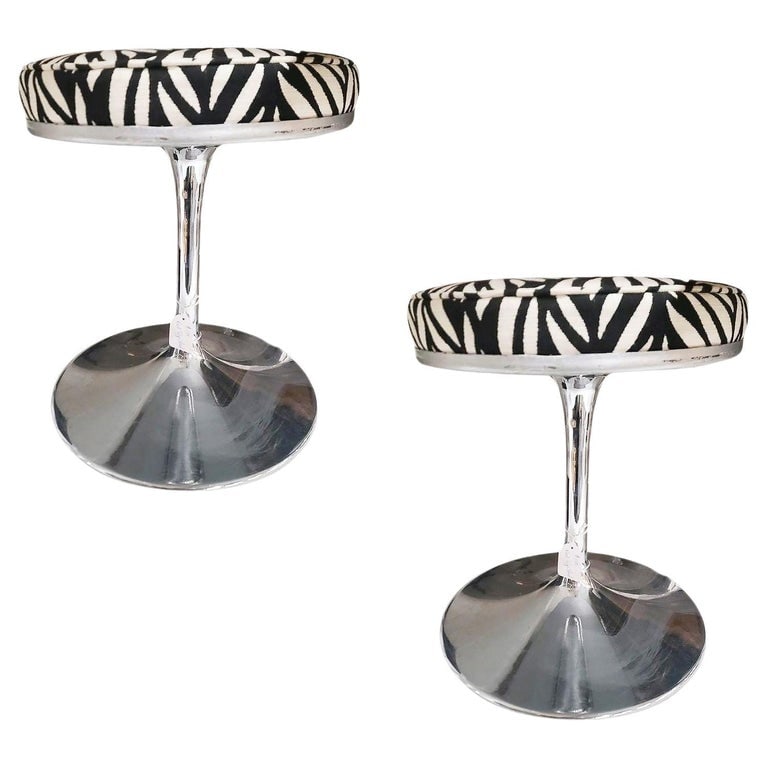 Knoll "Tulip" Chrome Stool by Eero Saarinen W/ Zebra Seat, Pair: Eero Saarinen designed a chrome stool with a "tulip" shape made popular by this model in the knoll company. This steel cast stool features the original chrome finish with a Zebra print fabric seat.195