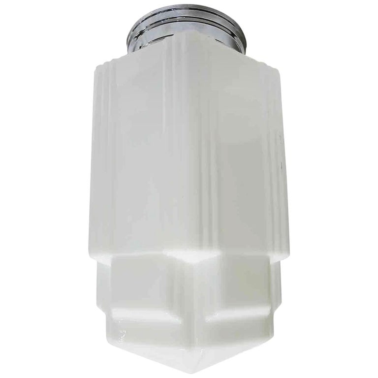 Tall Art Deco Stepped Skyscraper Ceiling Glass Globe Pendant, 4 Available: Unique Art Deco Stepped Skyscraper ceiling glass globe in white milk glass features distinctive skyscraper-style ribbed corners and a triple-tier design. Available with new Brass or Chrome 6" Fitter.S