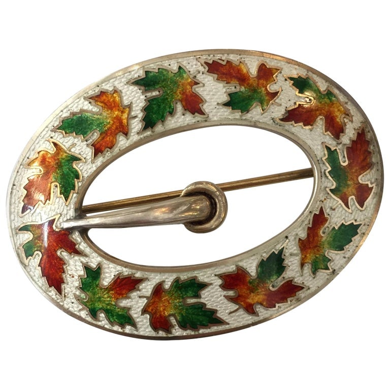 Sterling Enamelware Belt Buckle Brooch, circa 1904: Sterling silver enamelware belt buckle brooch with pin back.Signed with a Hallmark which reads "RD 1904 Sterling". Measures: 2 3/4" long x 2" wide.