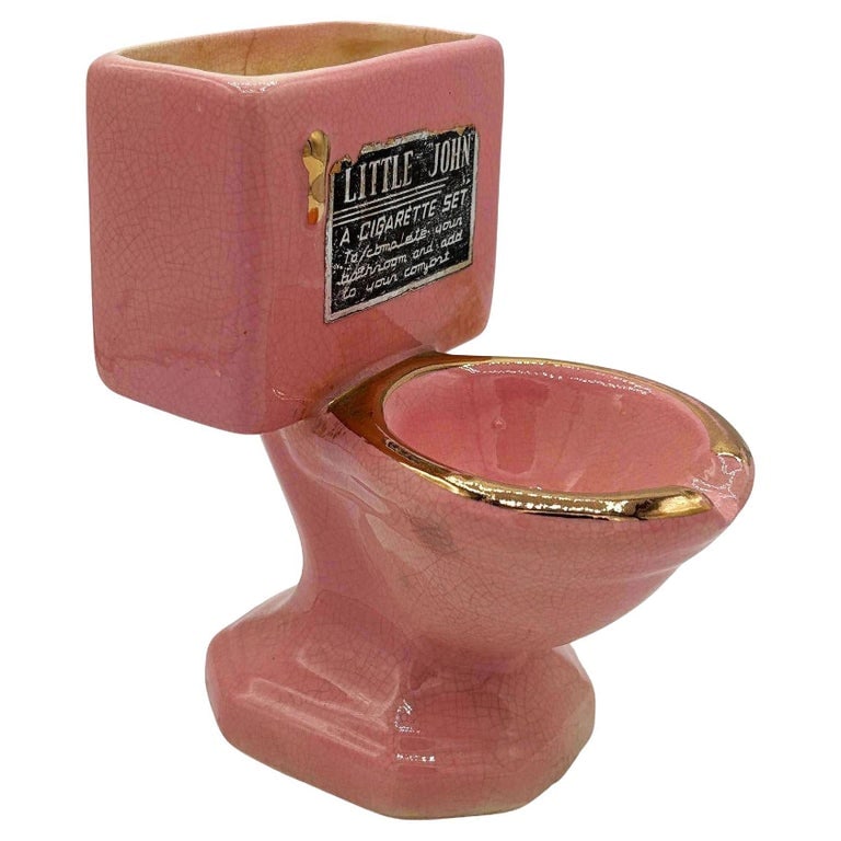 Mid-century Pink "Little John" Toilet Ashtray Cigarette Holder by Artmark, Japan: 1950s Ceramic "Little John" Toilet Ashtray Cigarette Holder by Artmark featuring a pink finish with gold-tone accents. A playful piece adding a little bit of humor with some mid-century charm to your