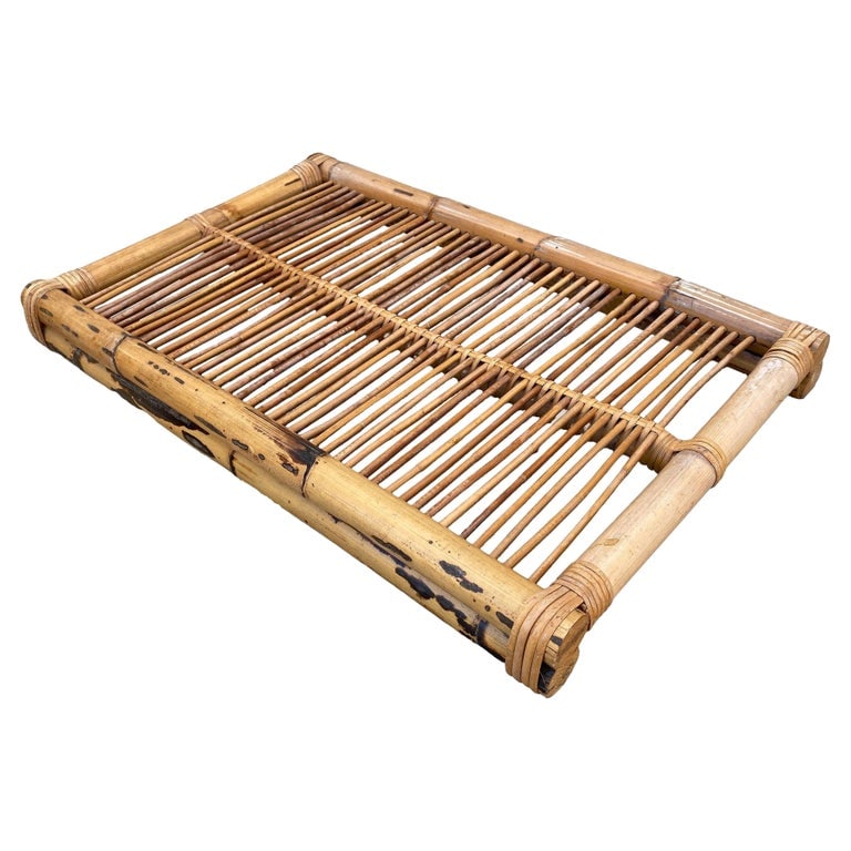 Restored Art Deco Stick Reed Rattan Serving Tray: This beautifully restored Paul Frankl-inspired Art Deco stick rattan Serving Tray features a pole rattan frame with a stick rattan grill making up the center of the tray. The piece is brought together