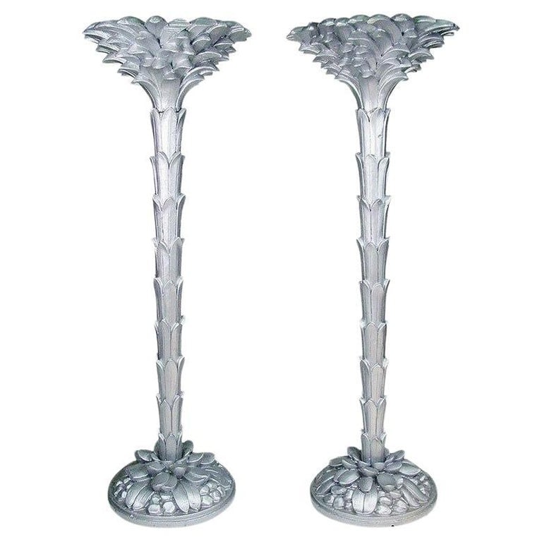 French Torchère Floor Lamps in the Manner of Serge Roche: Stunning pair of original French Art Deco torchère floor lamps in the manner of Serge Roche, circa 1930. The stunning Hollywood Regency style hand carved mahogany wood torchère's have been restored