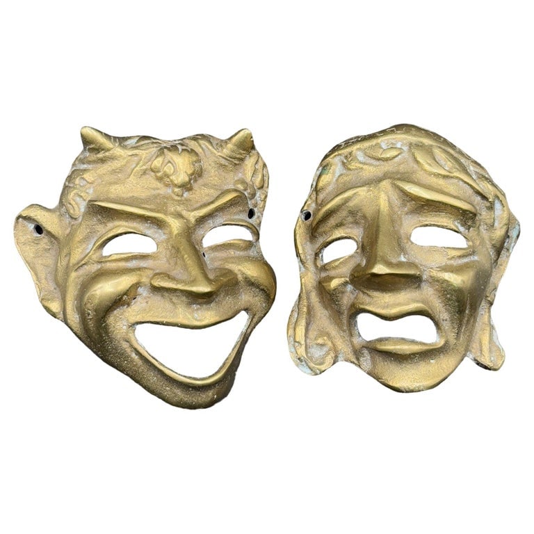 MCM Greek Theater Masks Comedy & Tragedy Wall Sculpture Hand-cast in Bronze Pair: Mid-century Hand-cast bronze Greco-Roman wall sculpture pair featuring Theater Masks, featuring Comedy & Tragedy. This striking pair of masks is inspired by classical Greek and Roman theater, symboliz