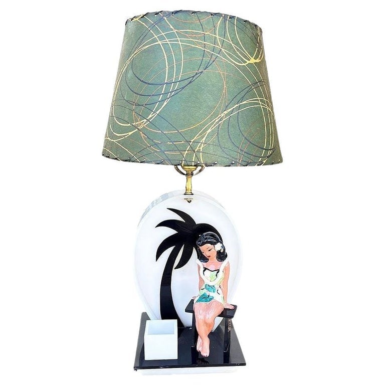 Mid-century Acrylic Hula Girl Midnight Palm Silhouette Table Lamp by Moss: Mid-century Midnight Palm Tree Hula Girl Silhouette Table Lamp by Moss. A charming mid-century tropical table lamp crafted from clear and black Acrylic sheets. The sculptural base features a seated Ha