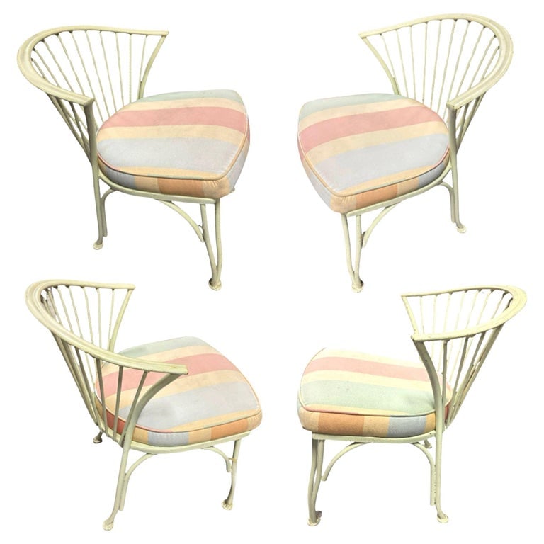 1950's Set of Four Woodard Pinecrest Outdoor Chairs: This elegant set of four Pinecrest outdoor armchairs effortlessly blends timeless design with durable craftsmanship. Crafted from sturdy wrought iron, the chairs showcase graceful curves and intricate