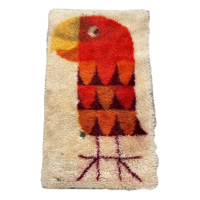 Mid-century 3' Foot Hand-Hooked Bird Tapestry Rug Wall Hanging: Hand-hooked late Mid-century wool tapestry rug featuring a Modernist abstract portrait of a Parrot done in yellow, orange, and brown against a beige background It is an excellent piece for accenting
