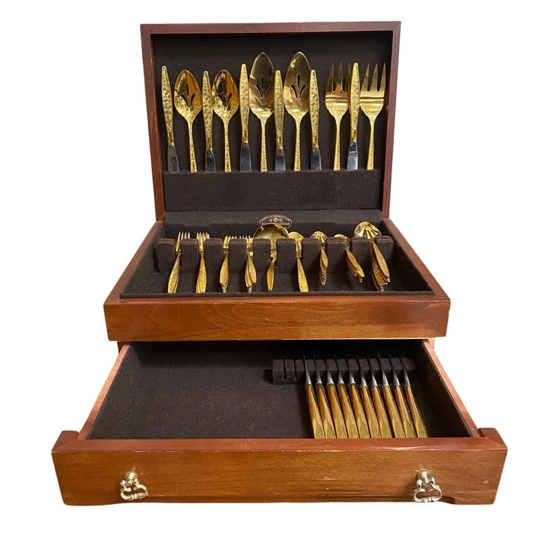 Modernist Pattern Gold Plated Stainless Flatware Set of 92 by 1847 Rogers Bros: This glorious gold-plated flatware made by 1847 Rogers Bros is a true work of art. This 92-piece set features a geometric shape with each piece's central decoration featuring a beautiful Mid-century m