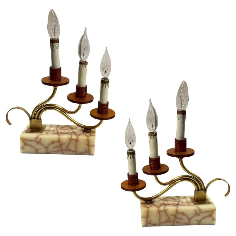Hollywood Regency Three Candle Bakelite & Brass Table Lamp, Pair: Two pairs of ornate fireplace mantles, each is a three-light candelabra white Bakelite, and brass table lamps. These candelabra are a good example of early designer Hollywood Regency style and are wir