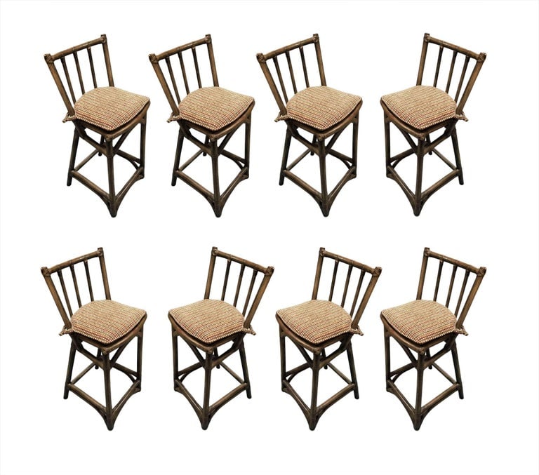 Mid Century Dark Stained Rattan Bar Stools with Stick Back, set of 8: Set of 8 dark Stained rattan bar stools with woven wicker seats and 3-strand rattan pull legs. The stools come with a fully formed backrest complimented by arches connecting each leg. Each seat comes