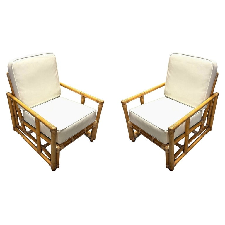 Restored James Mont Inspired Rattan Lounge Chairs w/ Modernist Arms: These Restored Rattan Lounge Chairs with Modern Cubist Arms fashion after classic East Asian designs much like the designs made famous by James Mont showcasing a blend of classic craftsmanship and con
