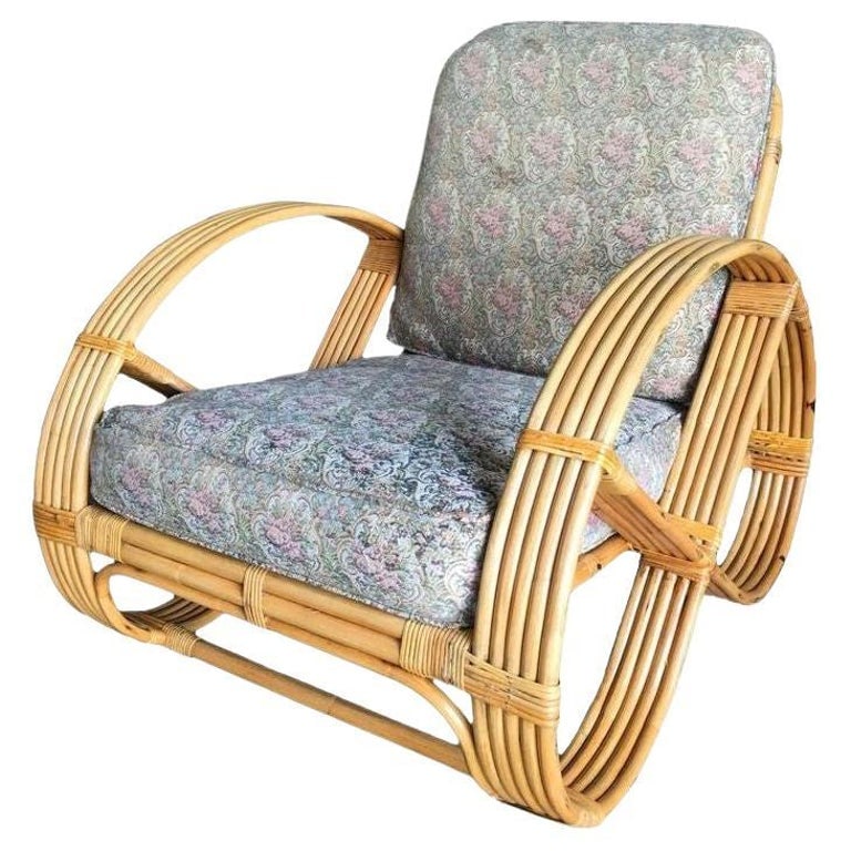 Restored Five-Strand Round Full Pretzel Rattan Lounge Chair: Rare five-strand round full pretzel arm rattan lounge chair with fancy wicker wrappings.1950, United StatesWe only purchase and sell the best and finest rattan furniture made by the best and most well