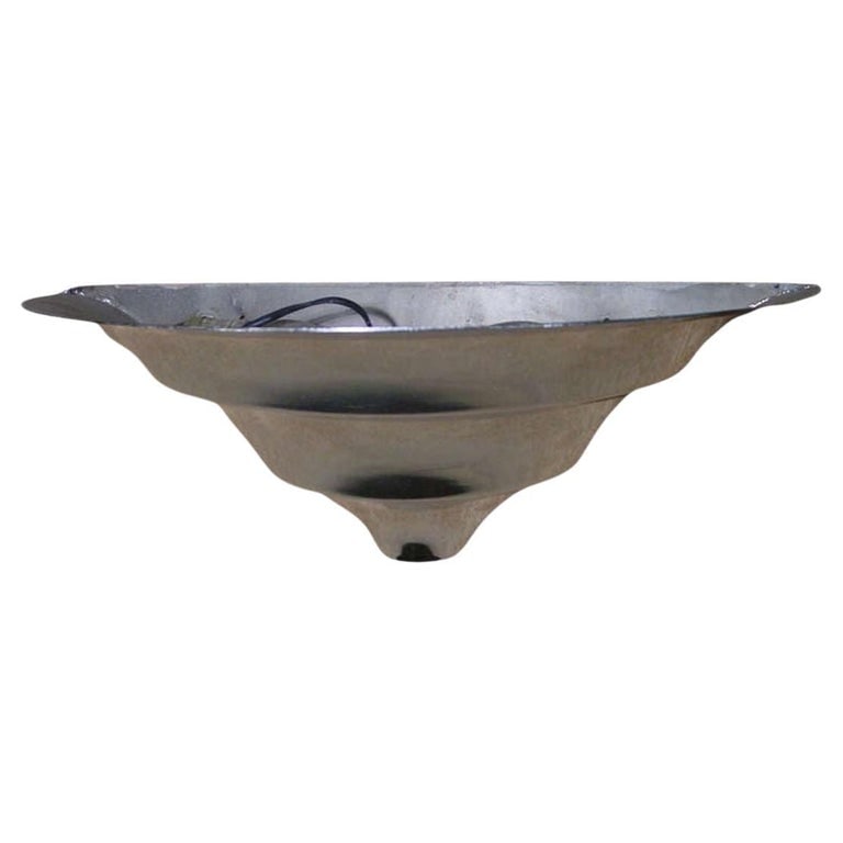 Art Deco Demilune Wall Sconce in Manner of Jean Perzel: Chromed steel demilune Art Deco wall sconce featuring a Streamline Moderne design with 3 round steps coming down to a coned point. The sconce is very reminiscent of the designs done by Jean Perzel and