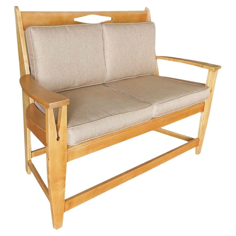 Blonde Wood Sofa with Clothespin Shaped Accents In The Style of Stickley: Vintage blonde wood Mission style sofa with clothespin shaped accents along the armrests and back and wicker cane seat in the style of Stickley. Comes with original cushions.Stickley furniture is reno