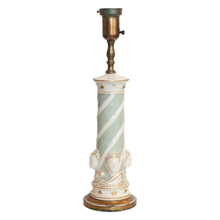 Ceramic Hollywood RegencyGreek Face Table Lamp by Rembrandt Light Company: Early Ceramic Regency Lamp featuring four female faces and painted gold accents by Rembrandt Light Company. The lamps feature a stunning mint green porcelain stem with a swirling design and the base o