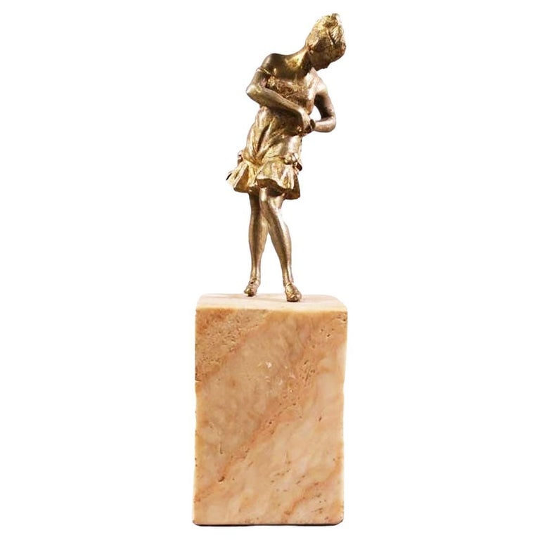 Brass Art Deco Flapper Girl Sculpture on Peach Marble Obelisk: This elegant Brass Art Deco flapper girl sculpture features a gracefully posed figure atop a peach-colored marble obelisk. The piece exudes 1920s charm with intricate detailing and vintage appeal. Sta