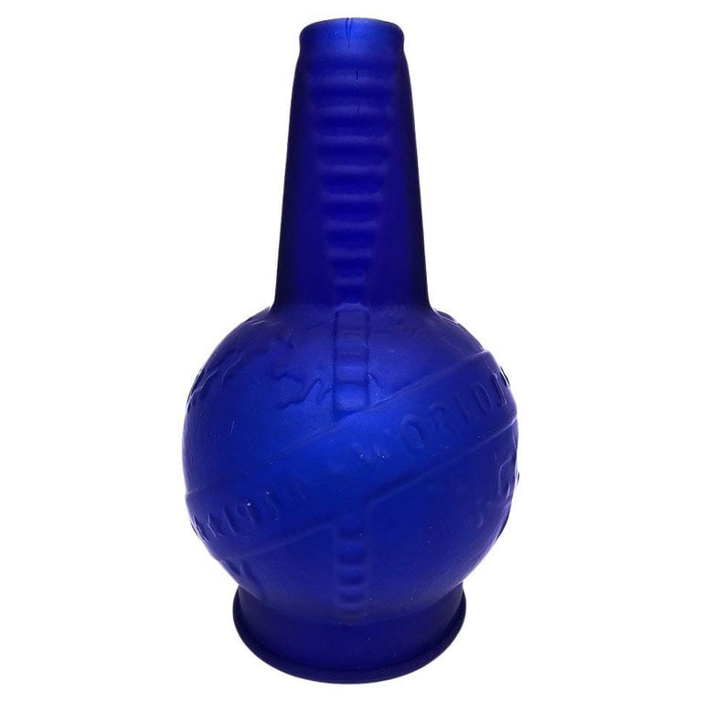 Frosted Cobalt Blue 1939 World Fair Bottle Lamp Base by Sarsaparilla, 20 Availab: Re-edition frosted cobalt blue 1939 World Fair bottle lamp base made by Sarsaparilla. The lamp base is made from a cast of the milk glass New York World Fair bottle that has been used as a lamp since