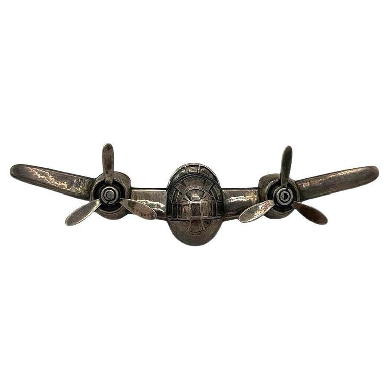 925 Sterling Silver B-25 Mitchell Aircraft Brooch w/ Moving Propeller Props: Vintage B-25 Mitchell bomber brooch with moving propeller props made from 925 sterling silver. The back of the pin-locking clasp and is signed "sterling".Measurements: 0.75" Tall X 4" Wide X .5"