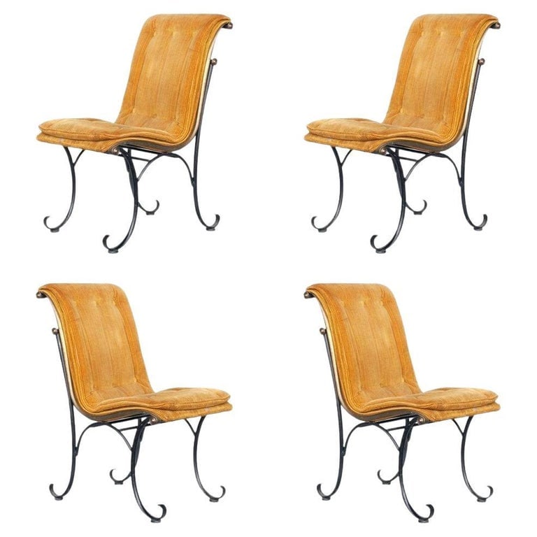 Regency Side Chairs with Bronze Accents by Russel Woodard, Set: Elegant Mid-century set of four iron Hollywood Regency/Mid-century style side chairs with bronze scrollwork accents, in curvilinear dynamic form and tufted gold velvet cushions. These chairs were feat