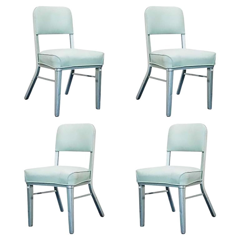 Set of Four Steelcase Industrial Tanker Chairs: Set of 4 Steelcase model 233 industrial office chairs featuring an all-steel frame with lime vinyl seating.The Steelcase company has been producing office furniture for over 100 years. In the 1930s th