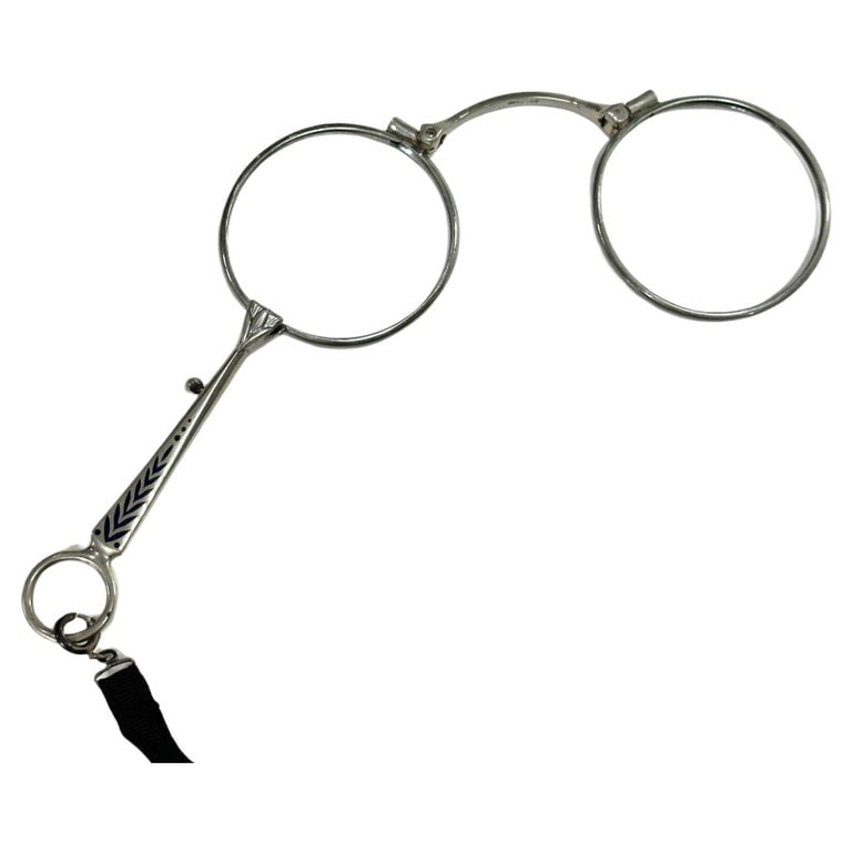 Antique German Lapis Lazuli and Sterling Silver Quick Relase Trigger Lorgnette: Silver Made in Germany Stamp Lorgnette with Lapis Lazuli Inlay on Handle. Has a quick-release trigger to allow quick access to bifocals. No Glass included.A lorgnette is a stylish handheld optical acc