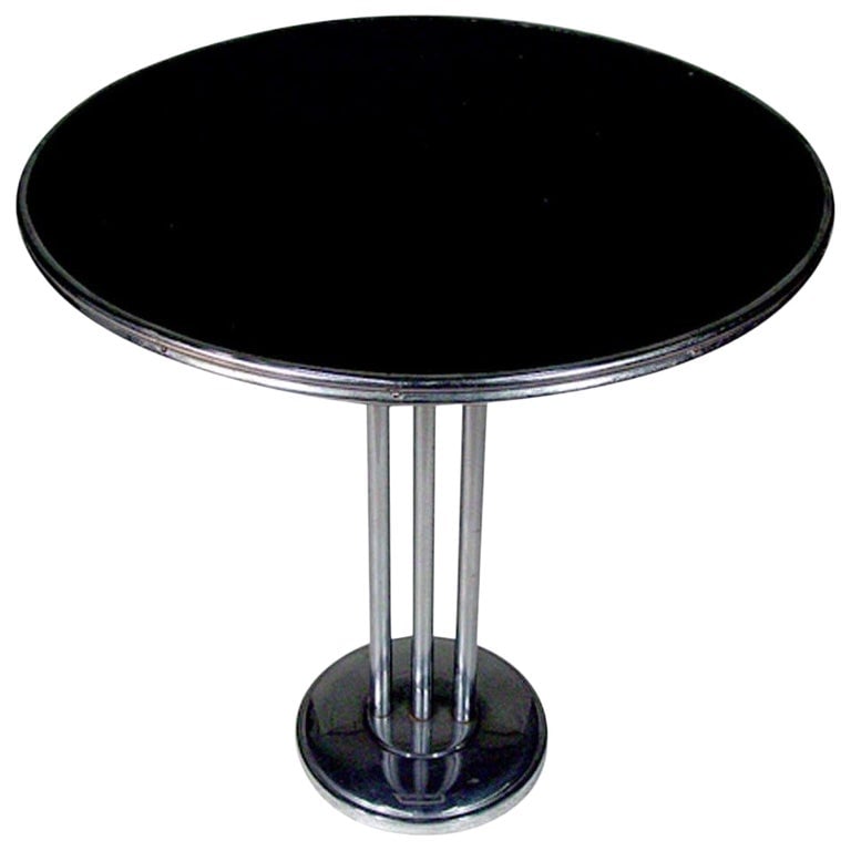 Chrome Streamlined Side Table with Tubular Legs: This versatile side table boasts a sleek chrome-tubular steel base adorned with decorative trim. Its adaptable size makes it a perfect fit as a center, lamp, end, or side table, ensuring functionality