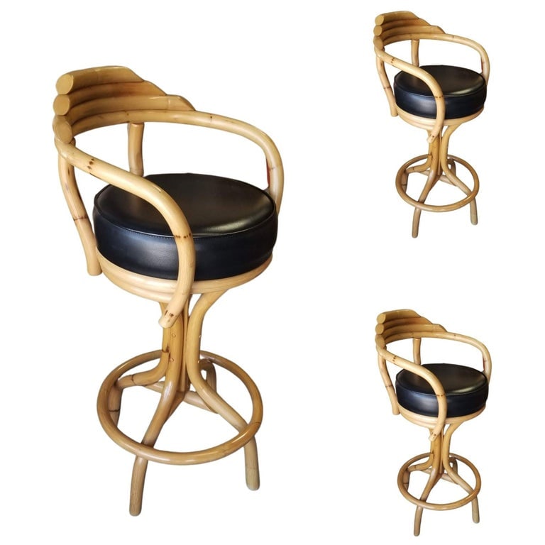 Restored Rattan Single Strand Set of Three Bar Stools: Upgrade your bar area with this charming set of three Restored Paul Frankl style Single-Strand Rattan Bar Stools. These vintage beauties feature stacked pyramid backs, offering a blend of style and co