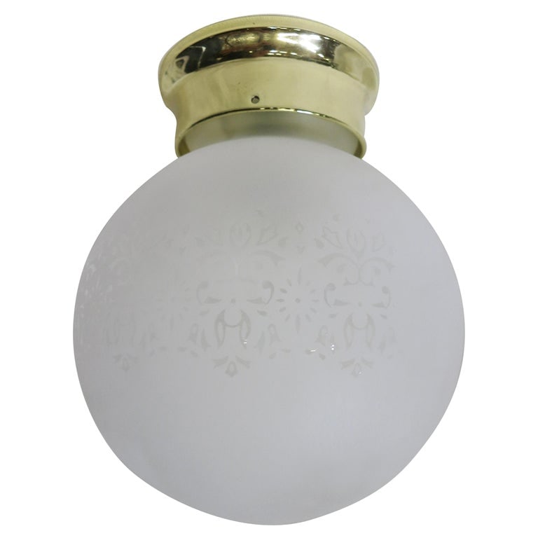 Satin Floral Glass Sphere Ceiling Glass Globe Pendant: This unique and exquisite art nouveau-inspired satin glass globe features an etched floral garland pattern detail that will add endless charm to any home. Available with a new Brass or Chrome 4" Fitte